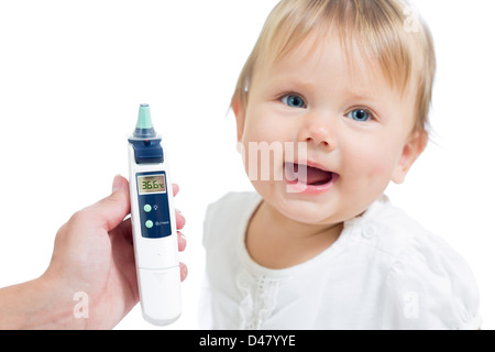 Thermometer displaying 36,6 Celsius degrees on defocused happy kid background. Concept of healthy baby. Stock Photo