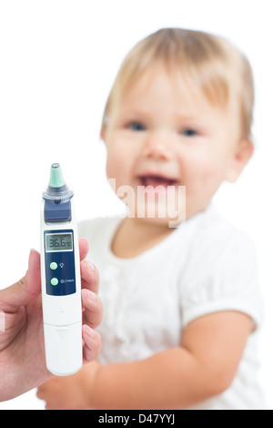 Thermometer displaying 36,6 Celsius degrees on defocused happy kid background. Concept of healthy baby. Stock Photo