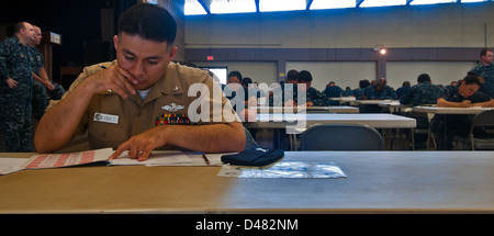 A Sailor takes the Navy-wide exam. Stock Photo