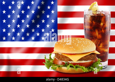cheeseburger and soda in front of the american flag. Stock Photo