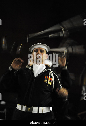 A Sailor from the Ceremonial Guard twirls a rifle. Stock Photo