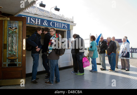 Queueing in the sunshine for fish and chips on Brighton pier, East Sussex, UK Stock Photo