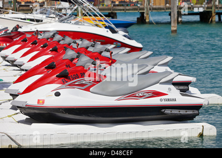 Personal watercraft lined up in a harbor Stock Photo