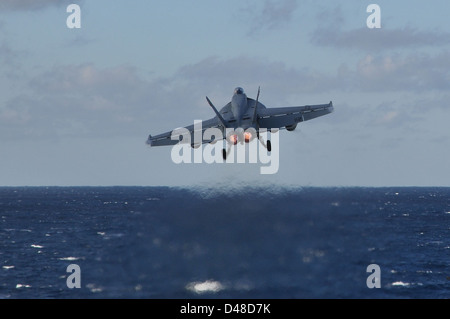 An F/A-18E launces from USS Dwight D. Eisenhower. Stock Photo