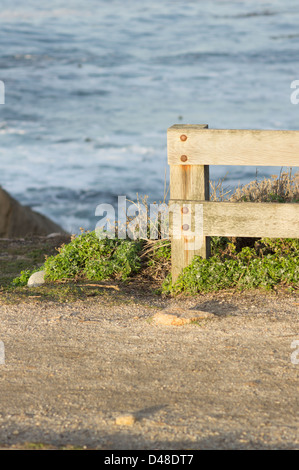 Wooden fence near the sea along the historic 17 Mile Drive in Pebble Beach, California Stock Photo