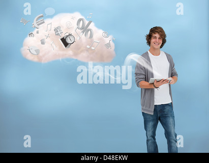 Casual young man using tablet for cloud computing Stock Photo