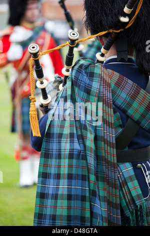 Piper playing Bagpipes in a Scottish Marching Band Stock Photo