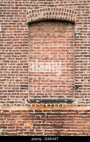 Wall with bricked up window. Stock Photo