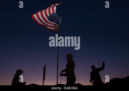 Sailors raise the American Flag. Stock Photo