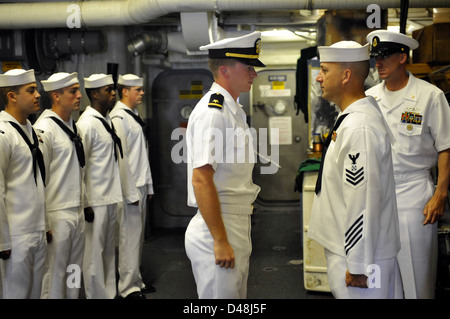 Usn Inspection An officer conducts a uniform inspection aboard a naval ship as part of ...