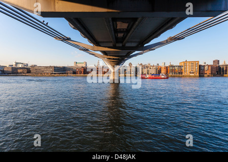 View of the River Thames from under the Millennium Bridge, South Bank, London, England, UK. Stock Photo