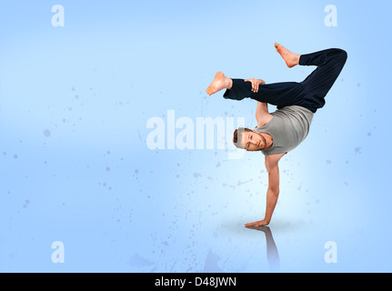 Break dancer doing handstand Stock Photo