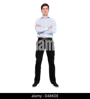 Full length portrait of young man with arms crossed isolated on white background Stock Photo