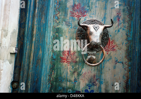 Bulls head doorknocker, decorated door Stock Photo