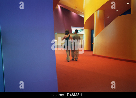 Couple walking through the Interior, Lowry centre, Salford Quays, Manchester Stock Photo