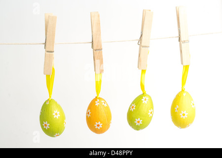 Four easter eggs hanging from a line Stock Photo