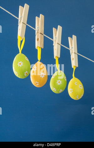 Easter eggs hanging from a washing line Stock Photo