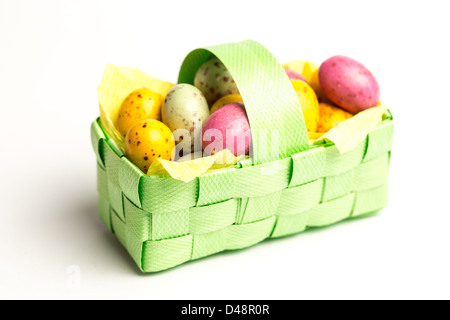 Speckled colourful easter eggs in a basket Stock Photo