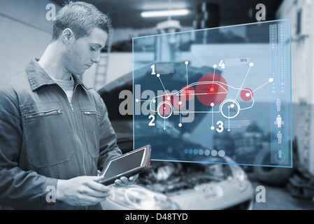Mechanic using tablet and futuristic interface in black and white Stock Photo