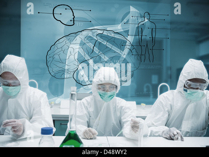 Chemists working in protective suit with futuristic interface showing DNA Stock Photo