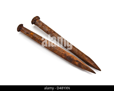 Two old rusty nails, on white background. Stock Photo