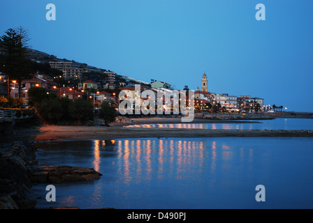 Small village on Mediterranean sea at dusk, Santo Stefano al Mare, Liguria, Italy Stock Photo
