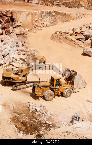 Workers and machinery in a marble quarry in Alentejo, Portugal Stock Photo