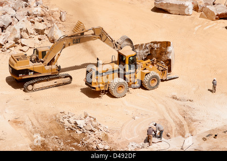 Workers and machinery in a marble quarry in Alentejo, Portugal Stock Photo