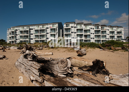 Siletz Bay, USA, with the bay Baumstaemmen and new apartments in the background Stock Photo