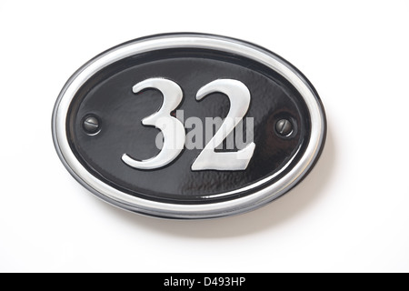 Number 32 black and chrome house plate. Stock Photo