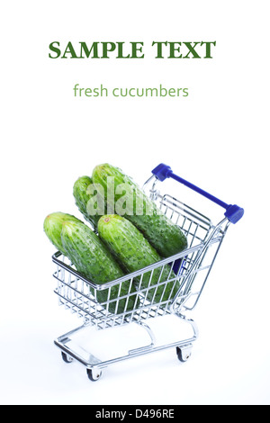 Cucumbers in a shopping cart on a white background  Stock Photo