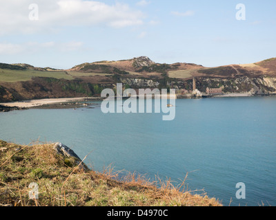 Porth Wen Isle of Anglesey North Wales March View across to derelict buildings of disused brick works viewed from Isle of Anglesey Coastal Path Stock Photo