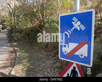 UK road sign warning lorry drivers not to use satellite navigation or sat nav on narrow country lane unsuitable for heavy goods vehicles access. Wales Stock Photo