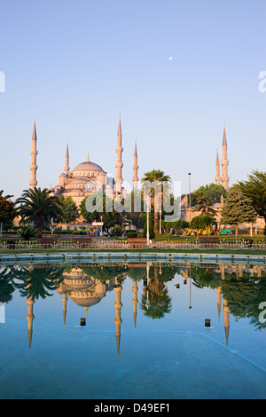 Dawn at the Blue Mosque (Sultan Ahmet Camii) with reflection on water in Sultanahmet district, city of Istanbul, Turkey. Stock Photo