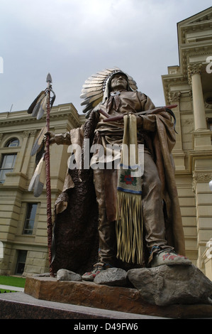 Grey sky portrait view bronze statue Chief Washakie standing plinth, front State Capitol building, Cheyenne, Wyoming, USA Stock Photo