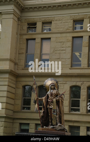 Portrait bronze statue Shoshone Chief Washakie standing front brown stonework State capitol Building, Cheyenne, Wyoming, USA Stock Photo