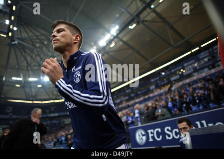 Gelsenkirchen, Germany. 9th March 2013. Schalke's Klaas-Jan Huntelaar enters the field to warm up during the Bundesliga soccer match between FC Schalke 04 and Borussia Dortmund at Veltins-Arena in Gelsenkirchen, Germany, 09 March 2013. Photo: KEVIN KUREK  (ATTENTION: EMBARGO CONDITIONS! The DFL permits the further  utilisation of up to 15 pictures only (no sequntial pictures or video-similar series of pictures allowed) via the internet and online media during the match (including halftime), taken from inside the stadium and/or prior to the start of the match. The DFL permits the unrestricted t Stock Photo