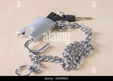 Chain with open padlock,on wooden table Stock Photo