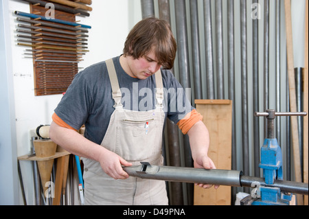 Meiningen, Germany, apprentice organ builder in the workshop Stock Photo