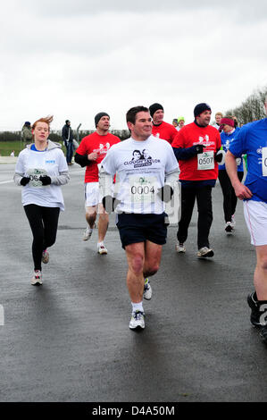 Donington Park, Derbyshire, UK. 10th March 2013.A new sporting event to celebrate the lifes of Brian Clough and Peter Taylor who achieved great footballing status with Nottingham Forest and Derby county in the 70's and 80's. While also rising funds for good causes.The 10k run took place at Donington Park race track on a very cold March Day.004 Nigel Clough,Derby County manger, and Brian Clough son. Stock Photo