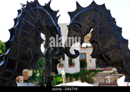 Rhodes. Greece. Three seahorse fountain decked with images of marine life on blue tiles inside Rhodes old town Stock Photo