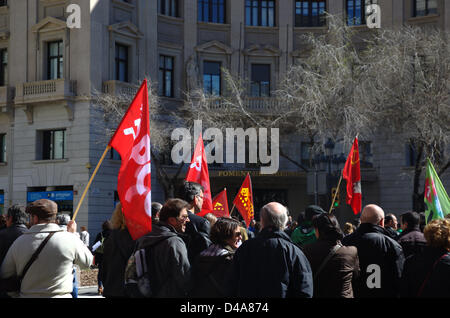 Barcelona, Spain. 10th March, 2013. Protests against Spanish and Catalonian government welfare cuts due to the economic crisis and the imposition of austerity as the remedy to resolve the crisis. Communists flags of the PCE (Partido Comunista Español). Stock Photo