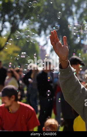 Berlin, Germany, is playing on the visitors Myfest in Berlin-Kreuzberg with soap bubbles Stock Photo