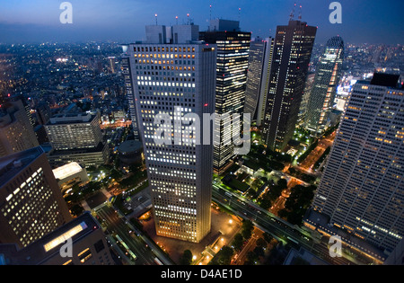 Evening city skyline aerial view of skyscraper high-rise corporate office buildings in Nishi Shinjuku (West Shinjuku), Tokyo Stock Photo