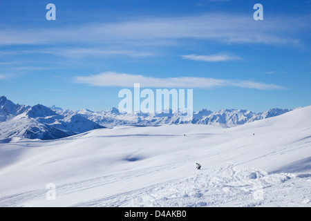 Skiers on Mont de la Guerre in winter sunshine, Champagny, La Plagne, France, Europe Stock Photo