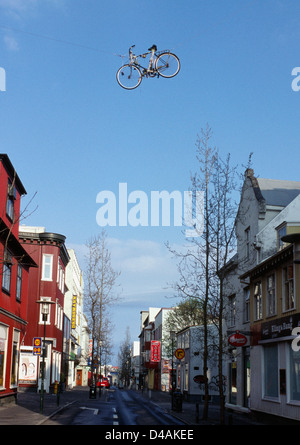 Bicycle art hanging over the streets in reykjavik, iceland Stock Photo