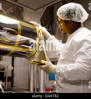 Chris Gunn, technician at NASA Goddard Space Flight Center, demonstrates the critical work of engineers and technicians in supporting space missions, operations, and technological development. Stock Photo