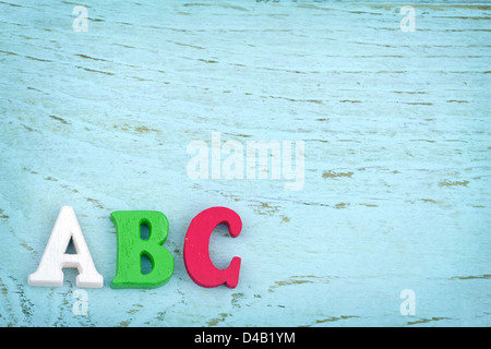 Letters ABC on light blue wooden vintage background - school and education background Stock Photo