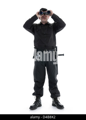 Security man wearing black uniform looking through binocular, shot on white Stock Photo