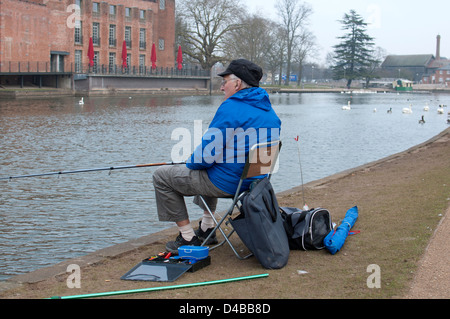 Fisherman on River Avon in winter, Stratford-upon-Avon, UK Stock Photo
